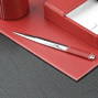 Red leather library set with close up of letter opener
